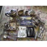 Silver plated items to include a four piece tea set, mixed cutlery and flatware, egg cups and a