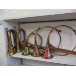 Early 20th century brass and copper military bugles and horns Location: RWM