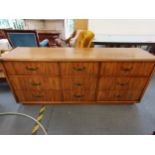 A vintage American military style chest of nine drawers by Drexel, 76 h x 178 w x 178cm d