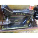 A 1958 Singer sewing machine serial number EN189395 in travel case with accessory box together