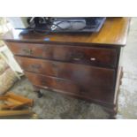 An early 18th century walnut three drawer chest of drawers on cabriole feet and with a later top