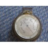 A compensated pocket barometer in half a case Location: Cab