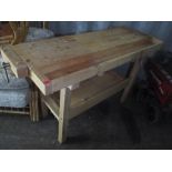 A beech wood work bench with a vice at either end 86cm h x 150cm w