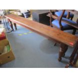 A 20th century pine long bench, on turned legs, 46cm h x 184cm long Location: RAF
