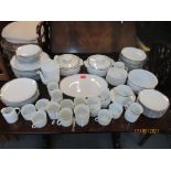 A Thomas china, German porcelain part dinner service, white glazed with silver coloured rim and a