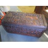 An African carved hardwood chest having a hinged top, 55cm h x 100cm w