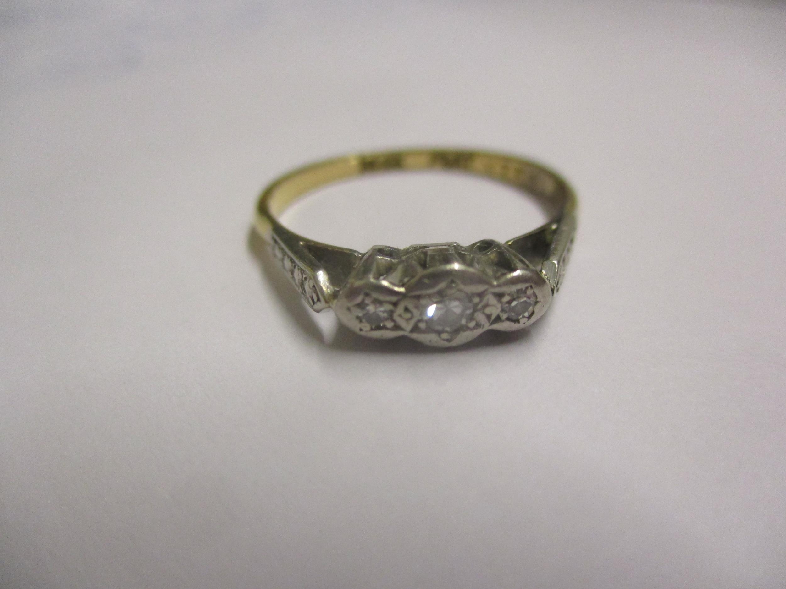 An 18ct white gold and 3 diamond ring, having a platinum illusion setting, stamped 18ct, ring size