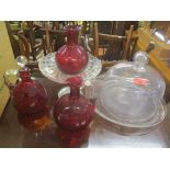 Glassware to include two Cranberry decanters, a vase, a cake basket, a cake stand