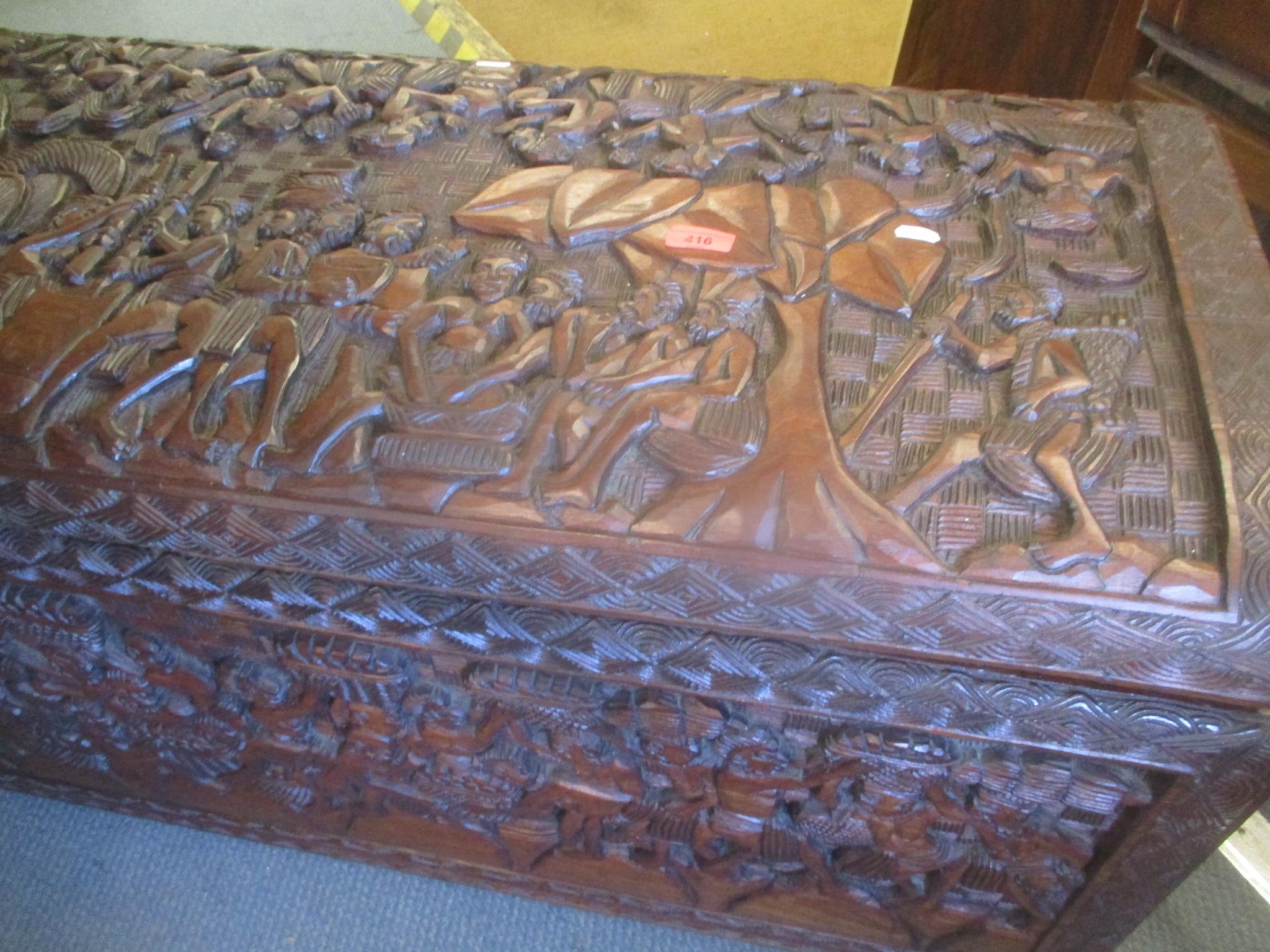 An African carved hardwood chest having a hinged top, 55cm h x 100cm w - Image 2 of 2