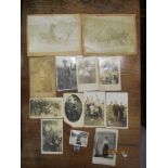 A small group of Victorian and later photographs to include two depicting horse and carts