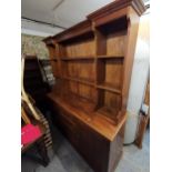 A stained pine dresser, 202 h x 170 w x 50cm d Location: G