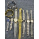 A quantity of gold coloured and silver coloured watches to include a ladies Lulu Guinness watch