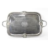 A Victorian silver plated on copper serving tray with a shaped, gadrooned and shell edge, engraved