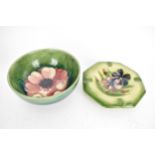 A Moorcroft Anemone pattern bowl raised on a short circular foot, signed W Moorcroft to the