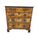 An early 18th century walnut chest of two short and three long drawers, the drawers having string