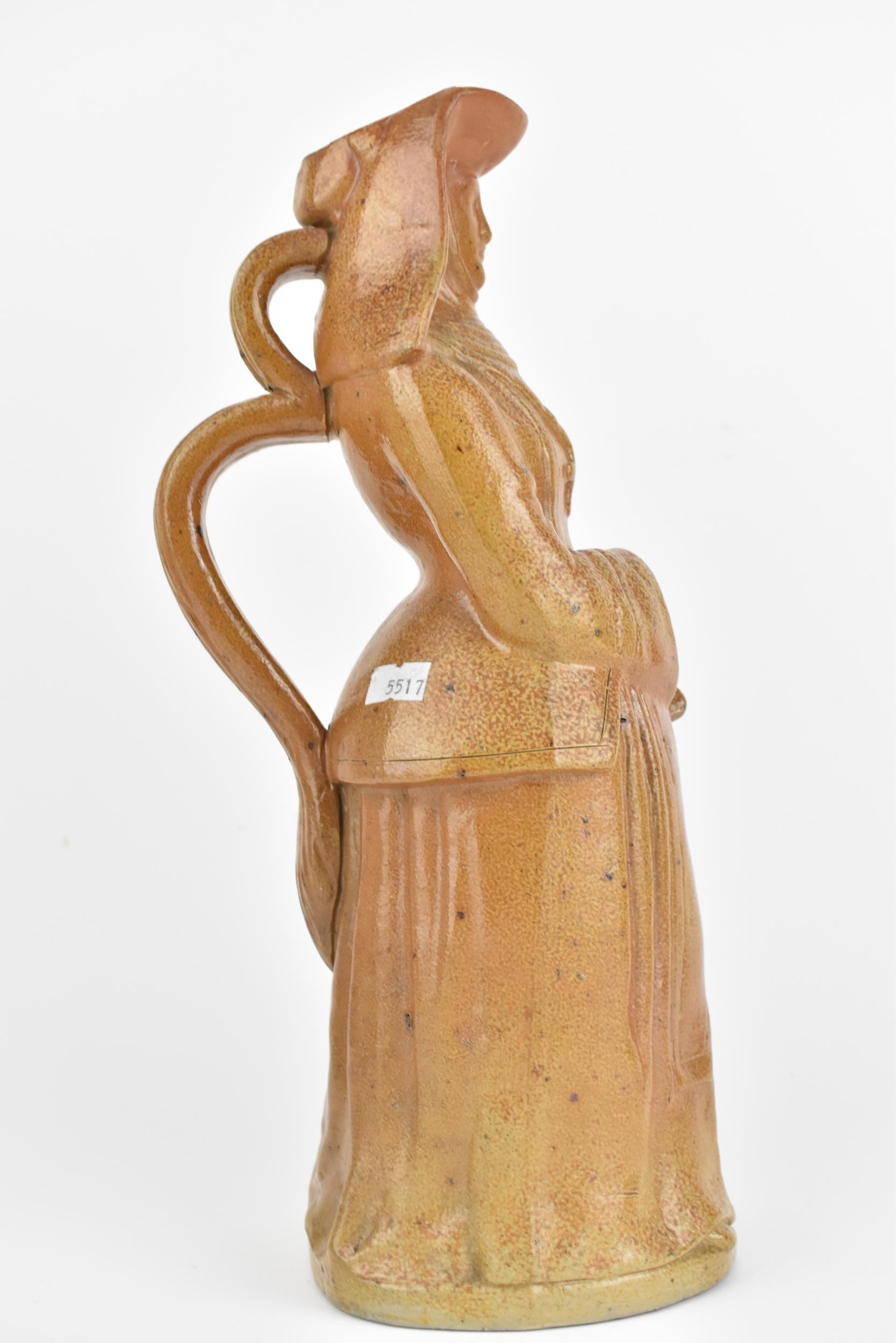 A 19th century salt glaze stoneware jug fashioned as a nun holding rosary beads, 36cm high, - Image 4 of 8