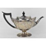 An Edwardian silver teapot by Mappin & Webb, Sheffield 1910, with a lobed body on a splayed, oval
