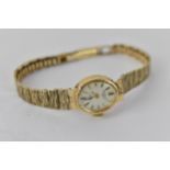 A Rotary 9ct gold ladies wristwatch, with an oval batten dial, on a textured, flexible strap, 15.