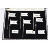 A set of early 20th century silver plated sandwich markers in the form of flags, in a fitted case