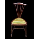 An Arts & Crafts mahogany fan spindle back chair, in the style of Adolf Loos, having a tapestry