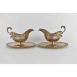 A pair of early 20th century sauce boats, Mappin & Webb, each gadrooned rim, shaped body and