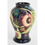 A Moorcroft vase in the Queens Choice pattern and of baluster form, dated 2000 to the base, 16 cm