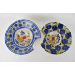 Two 18th/19th century Spanish faience bleeding/shaving bowls each decorated with a bird to the