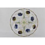 A 19th century hand cut glass bowl, with reverse gilt and enamel floral decoration, 6cm h x 28cm d