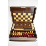 A late Victorian/Edwardian mahogany games compendium box containing playing cards with boxes,