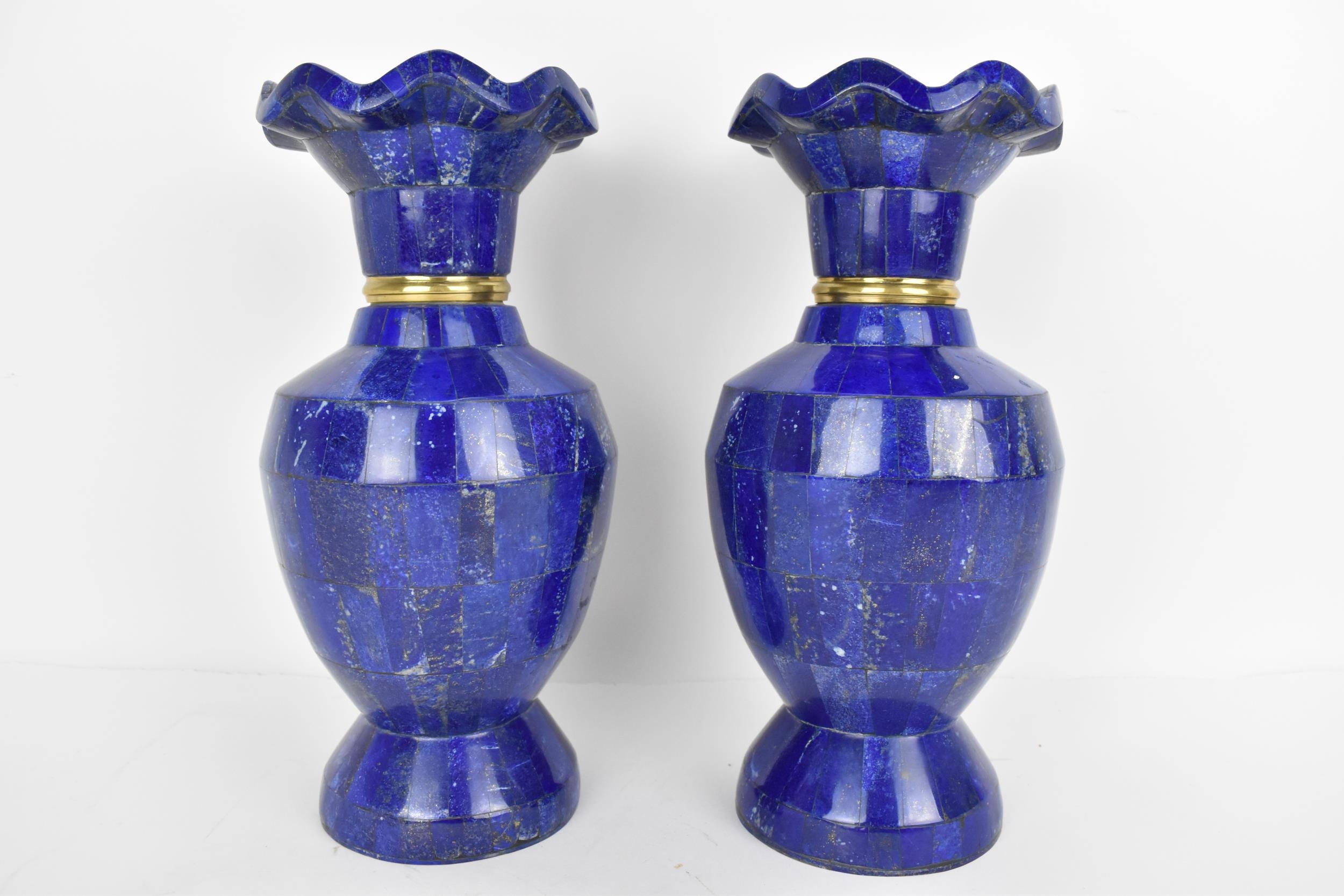 A pair of Lapis Lazuli vases with scalloped rim and gilt metal collars, 30cm h