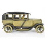 An early 20th century Bing, tin plate clockwork car, 14cm h, 26.5cm w, 10cm d. Condition some