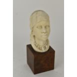 An early 20th century African Ivory bust on walnut plinth, with provenance Condition: good