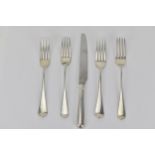 Four early 19th century Old English pattern table forks and a modern silver handled dinner knife,