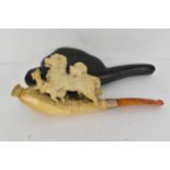 A late 19th century Meerschaum pipe with a gold band, the bowl surmounted by a cat sitting on top of