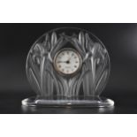 A Lalique clear and frosted glass Iris mantle clock, signed to rim, with original box, 27cm h