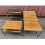 A nest of three Howard Miller for 'MDA' rectangular teak and chrome occasional tables, largest 48.5h