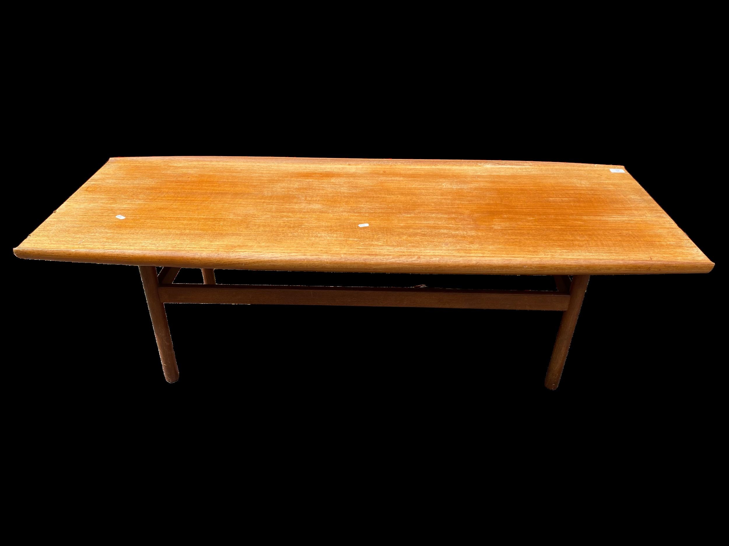 A Dalescraft mid 20th century teak coffee table of rectangular form with curved edges, 44.5h x 151.