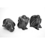 Three Lalique black glass nude statuettes in meditating poses, signed 'Lalique France' to the bases,