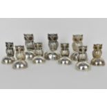 A selection of early 20th century silver menu or place name holders in the form of owls, two