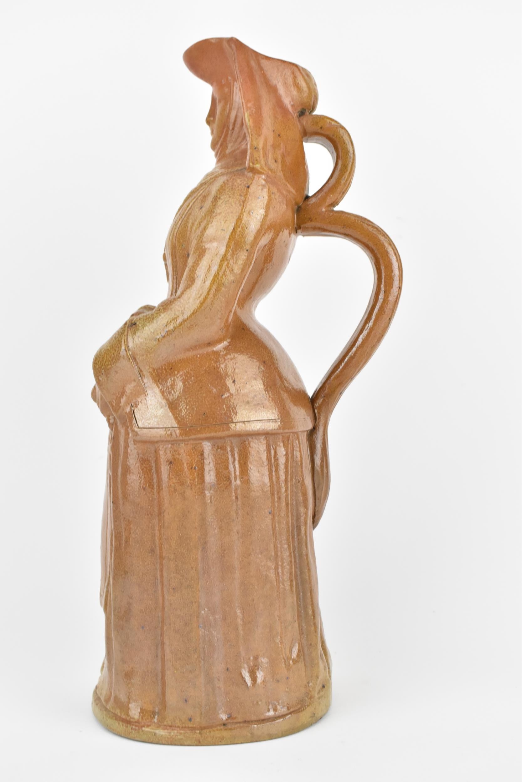 A 19th century salt glaze stoneware jug fashioned as a nun holding rosary beads, 36cm high, - Image 2 of 8