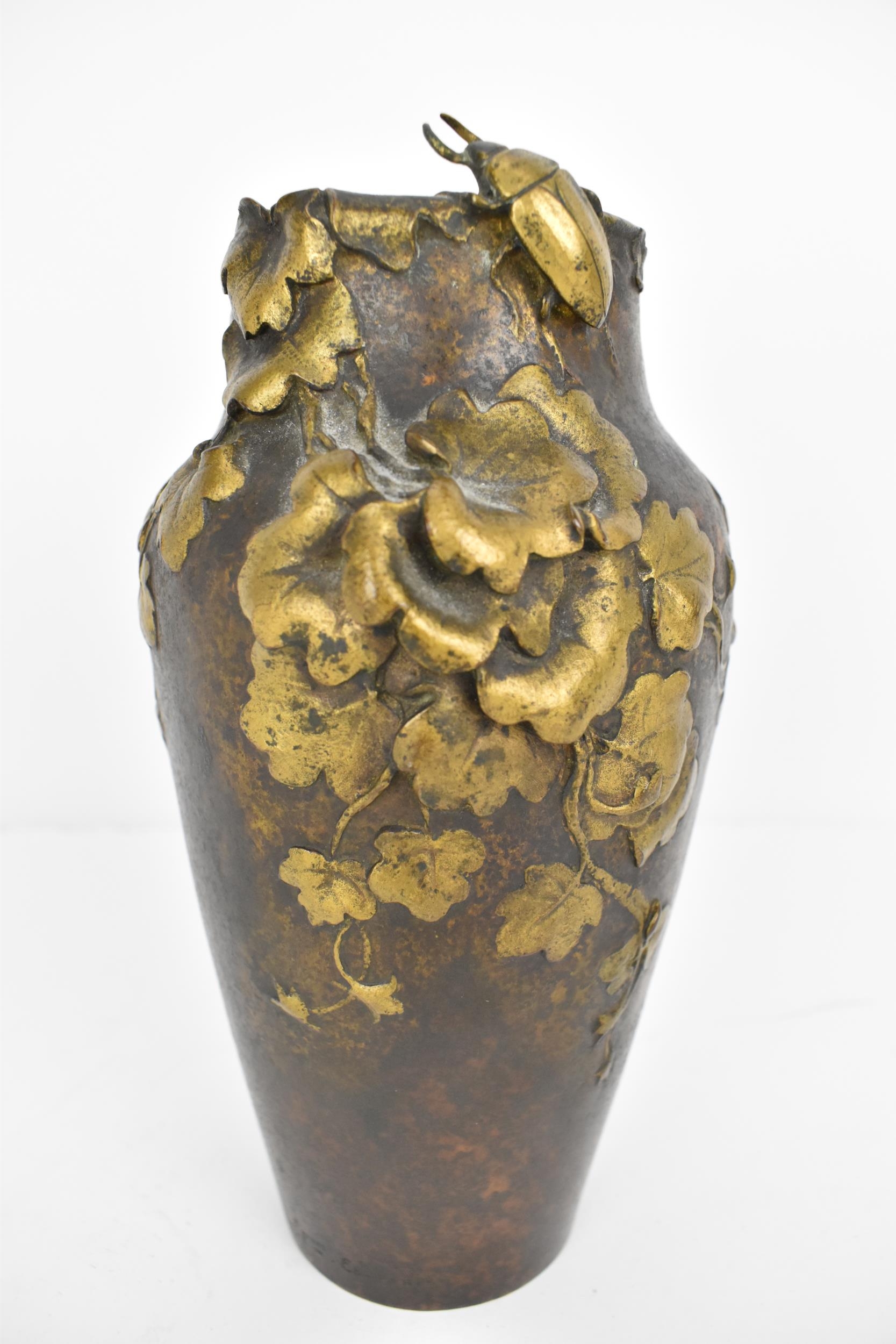 Frederic J Debon, a French Art Nouveau bronze vase with gilt floral and beetle decoration, signed