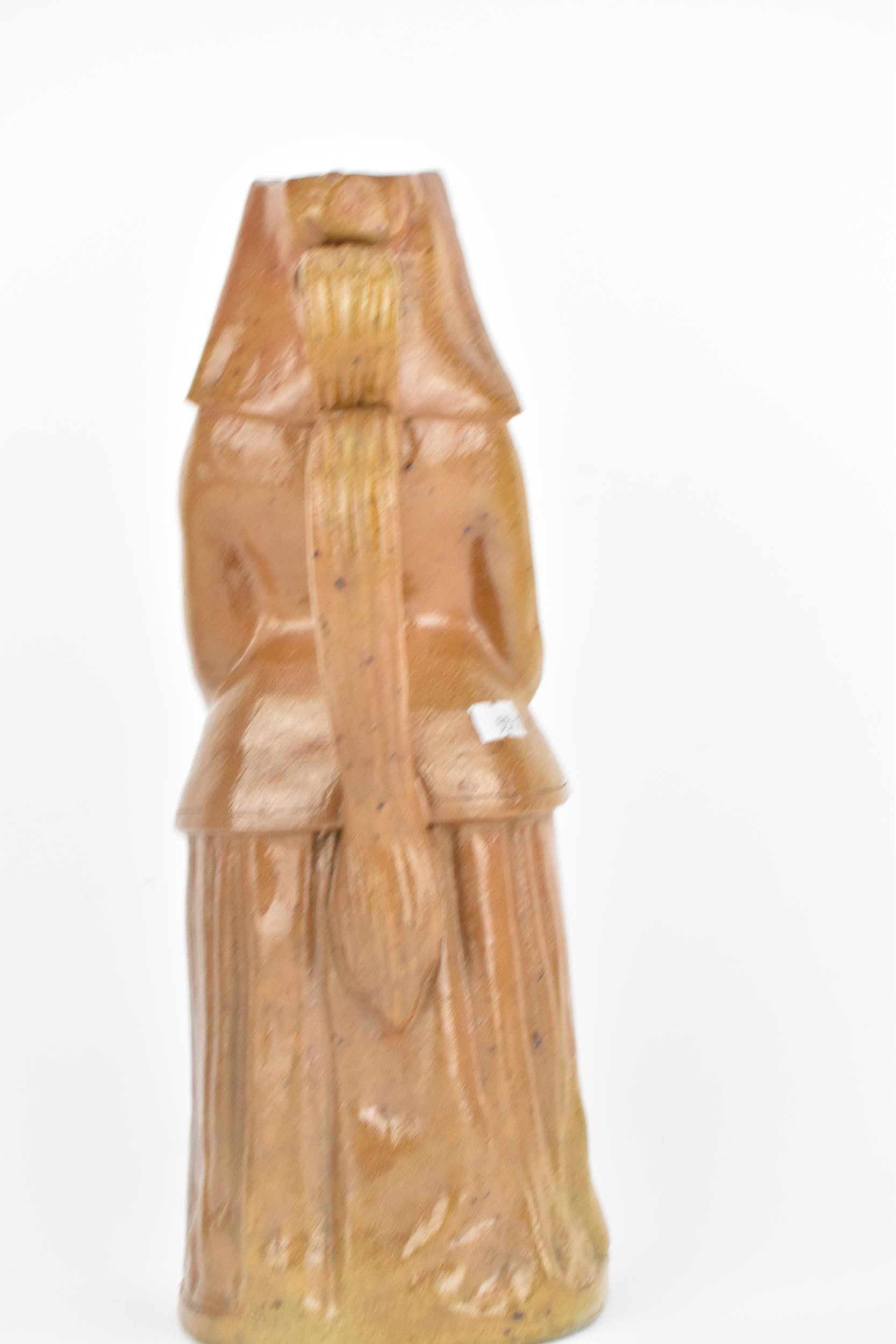 A 19th century salt glaze stoneware jug fashioned as a nun holding rosary beads, 36cm high, - Image 3 of 8