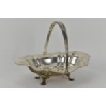 An Edwardian silver bread basket by Alkin Brothers, Sheffield 1908, with a reeded swing handle and