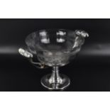 An Art Deco silver plated centre bowl having twin carrying handles with scroll shaped supports