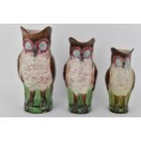 A Victorian graduating set of three Majolica jugs in the form of owls, each marked 25 to base,