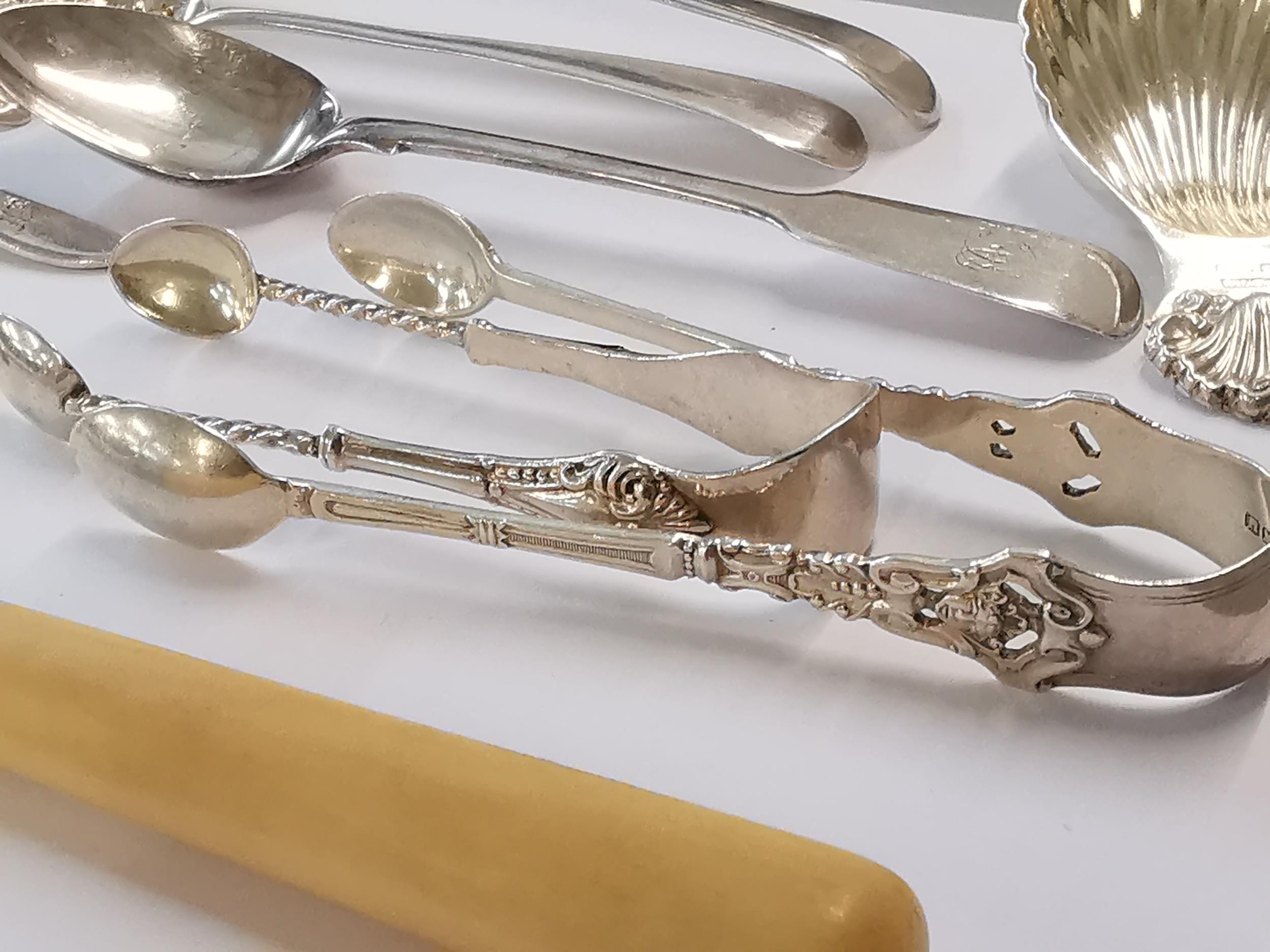 Silver to include two Georgian berry spoons, two Georgian teaspoons, a Victorian teaspoon, a caddy - Image 2 of 3