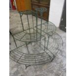 A pair of 20th century green metal corner outdoor slatted plant stands
