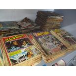 A collection of comics mainly form the 1970's to include Commando, War Picture Library, Wild West,