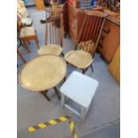 Mixed furniture to include a pair of Ercol dining chairs, a brass top nomads table, and a blue