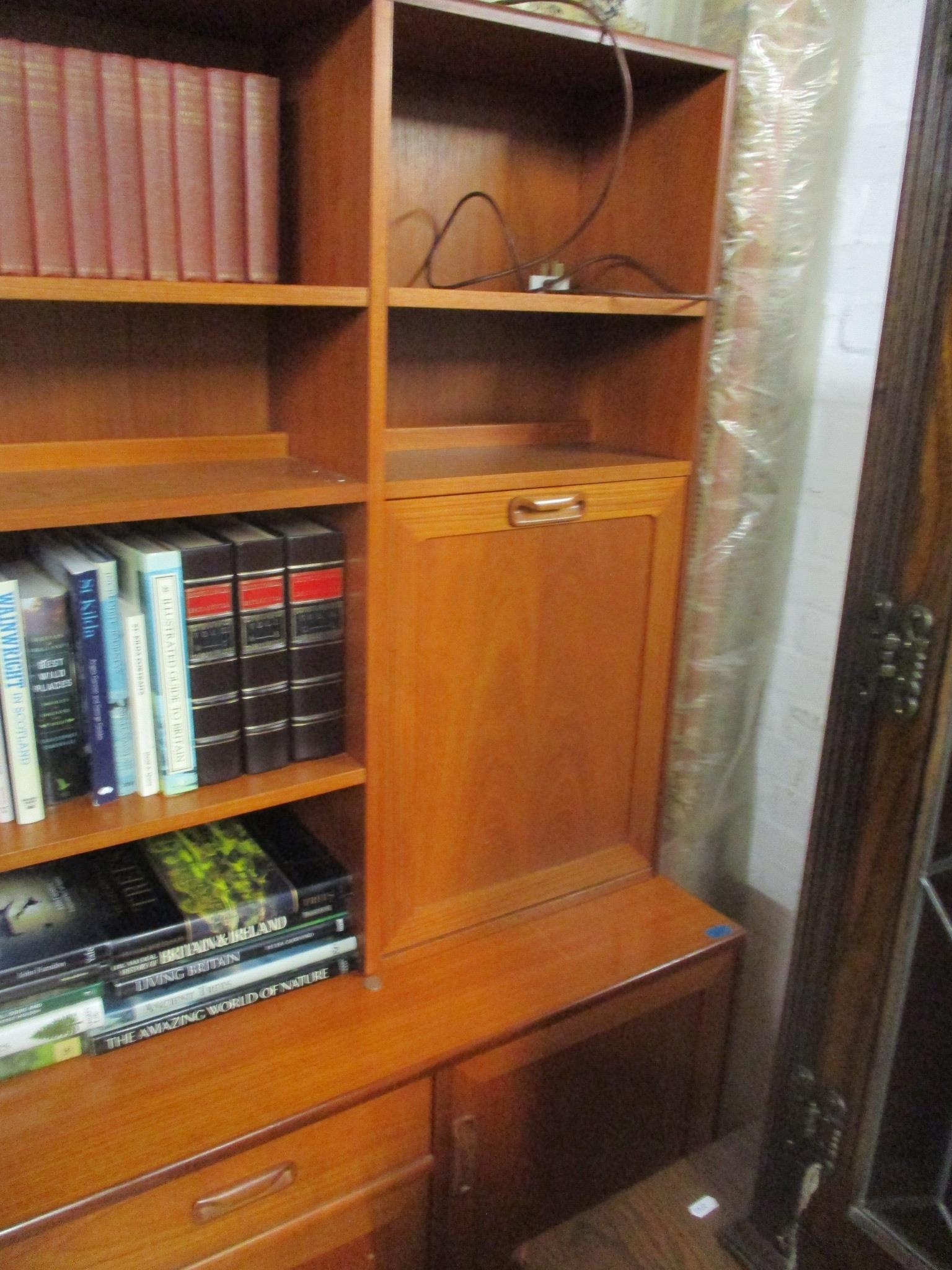 A mid-century G-Plan teak display cabinet having open shelves, cocktail cabinet, glazed door with - Image 2 of 3